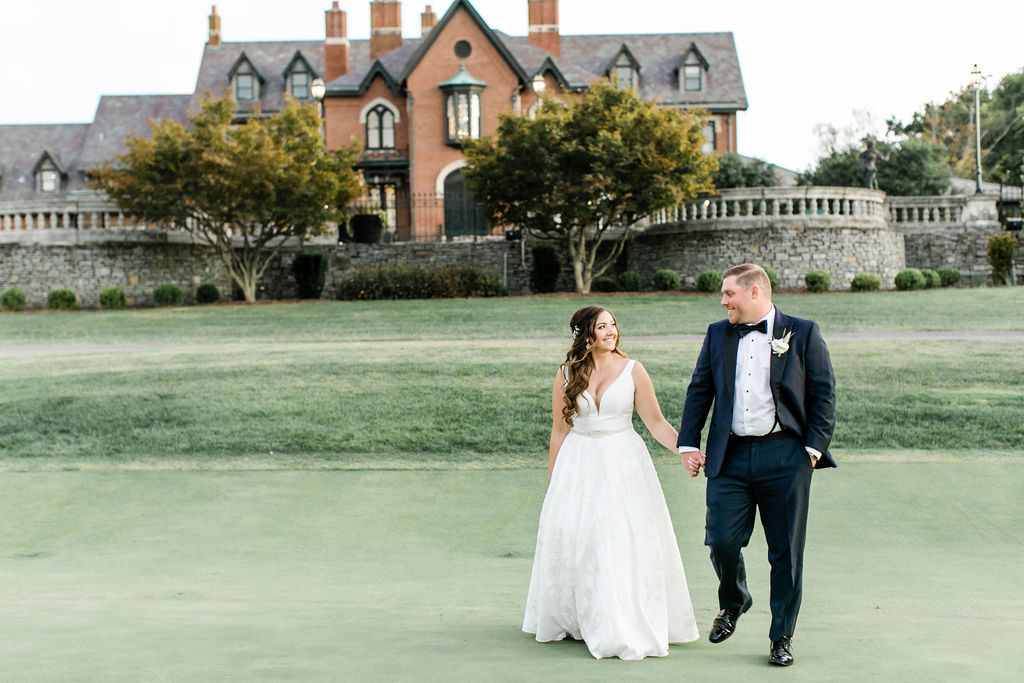 The bride and groom walk the grounds of the Hurstbourne Country Club in Louisville, Kentucky