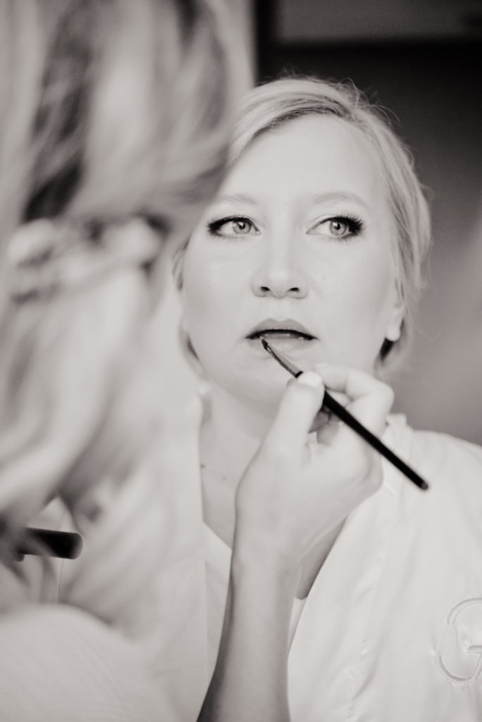 The bride getting her make up done