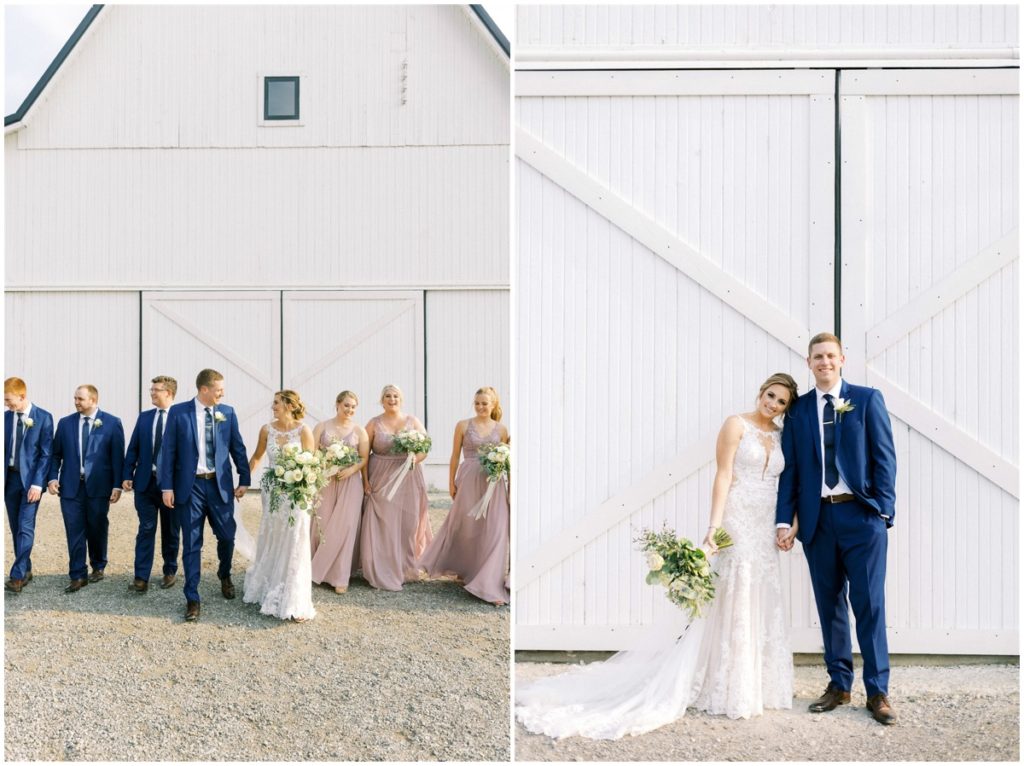 The bride and groom take photos outside the wedding barn at white willow farms in indiana