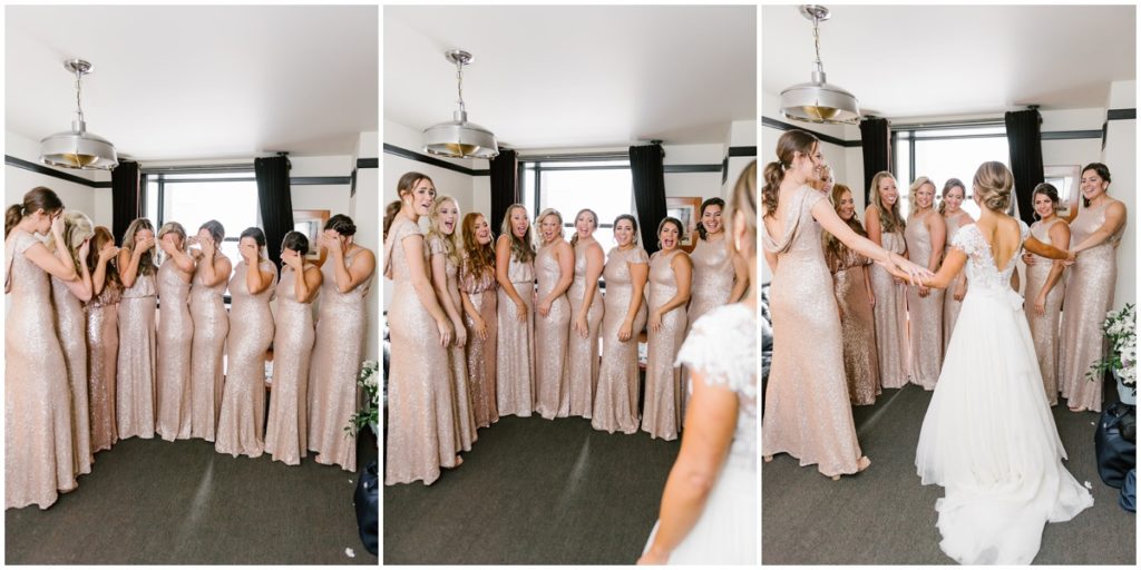 The bride does a first look with her bridesmaids in the hotel room