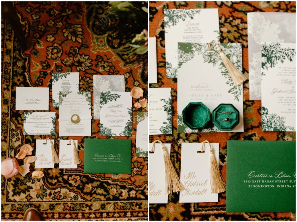 wedding-flatlay-with-invitation-jewlery-flower-petals-on-patterned-rug-at-the-wilds-wedding-venue