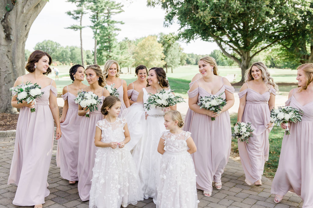 The bride, bridesmaids and flower girls outside of the Hurstbourne Country Club in Louisville, Kentucky.