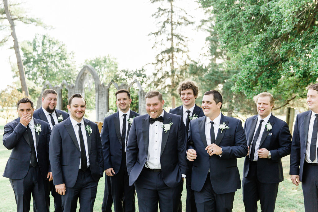 The Groom and his groomsmen on the grounds of Hurstbourne Country Club
