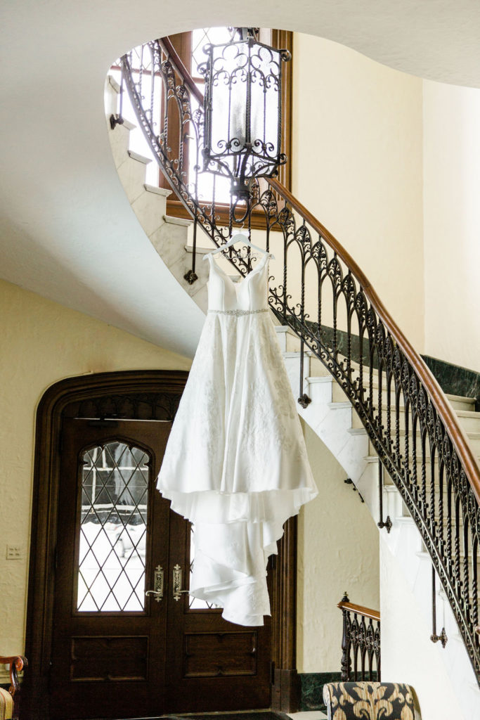 The bride's wedding dress hanging in Hurstbourne Country Club's bridal ready room. 