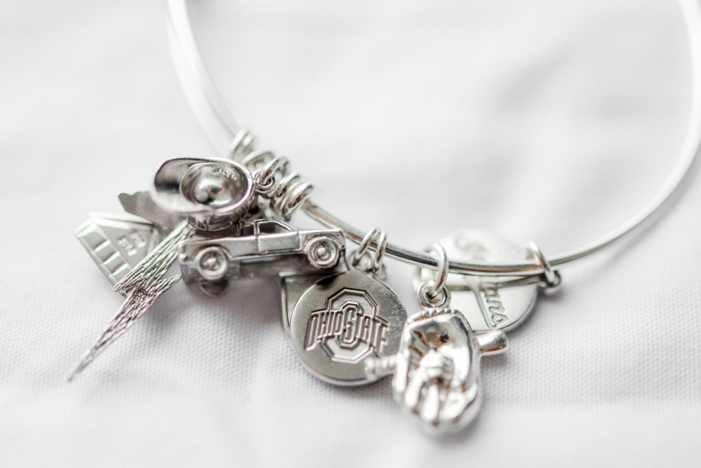 The bride's personalized charm bracelet with unique, meaningful charms