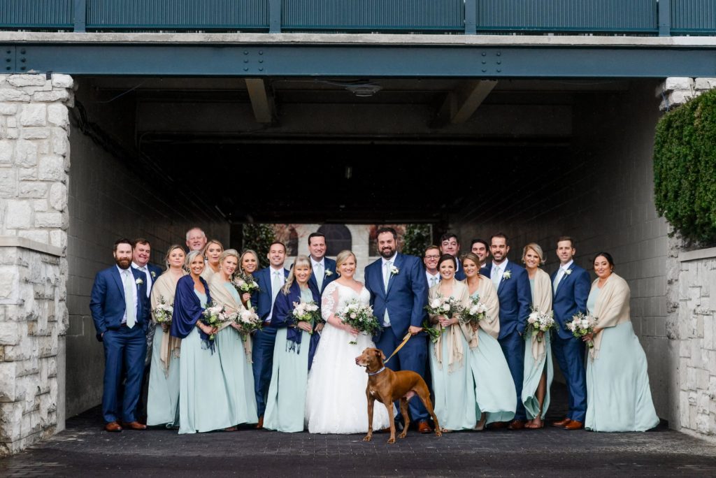 The wedding party outside of the Keeneland venue with the bride and groom's dog