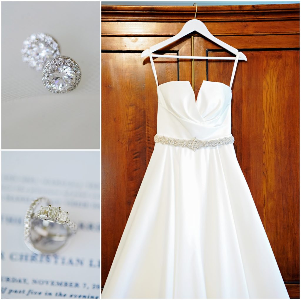 Bridal details including her diamond wedding ring and earrings as well as her white satin wedding dress