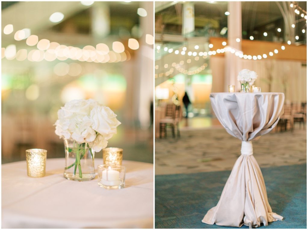 Cocktail tables with white flowers and candles inside the Indianapolis central library