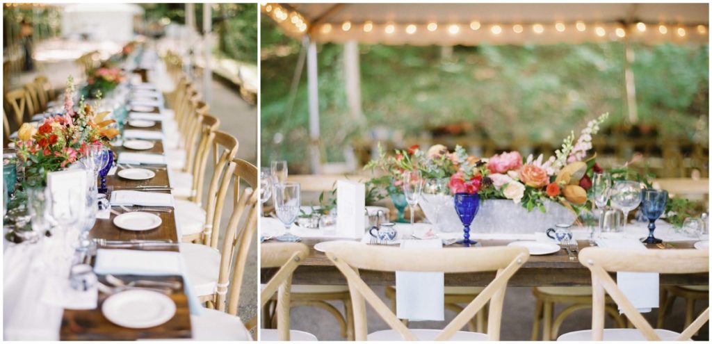 The reception at this private property wedding was held under a large white tent, with wooden farm tables and cross back chairs, market lights and colorful table accents 