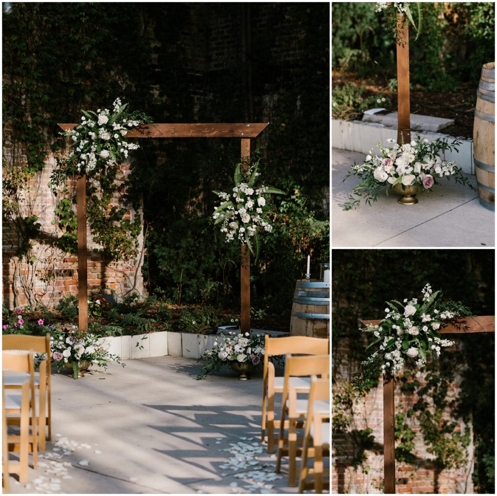 The ceremony alter consisted of dark wood beams, white and pink floral arrangements and wine barrels on each side