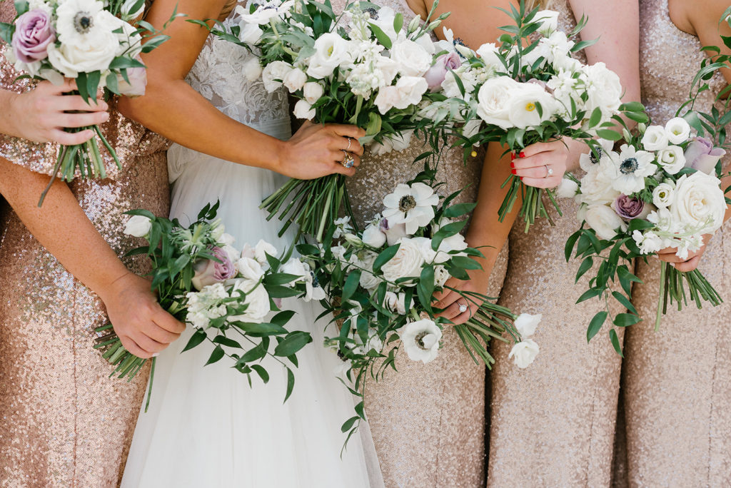 a close up shot of the bridal party's flower bouquet's
