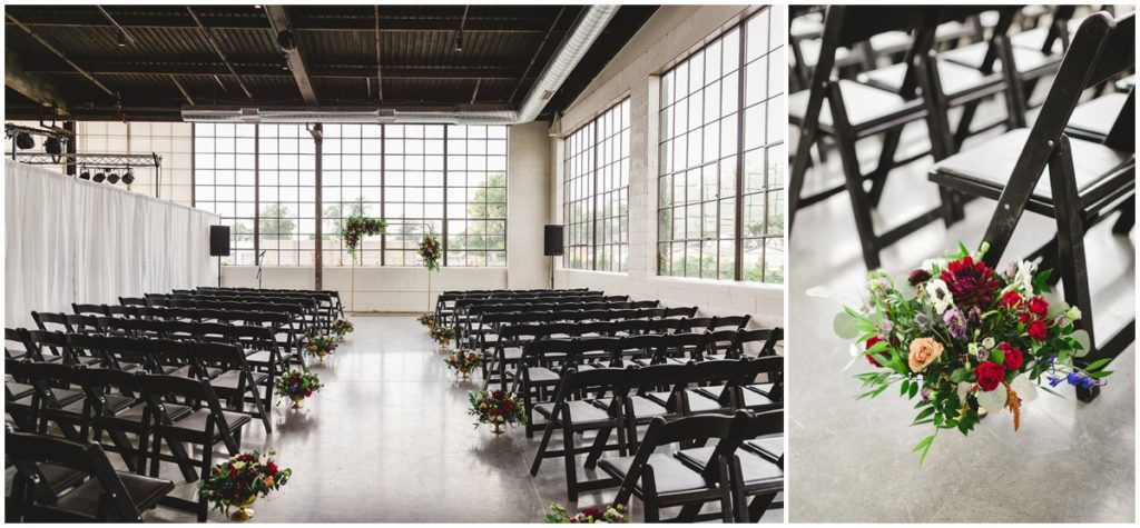 The ceremony set up inside of the Clerestory has back chairs, the aisle was lined with flower bouquets and a simple golden arch accented with flowers