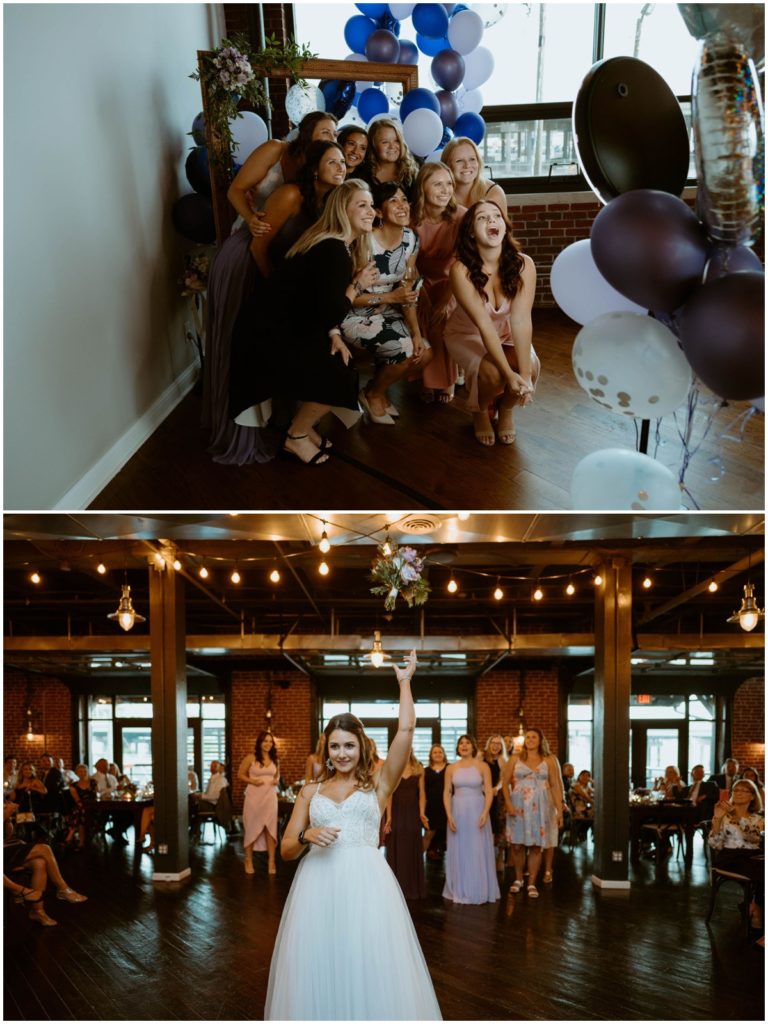 a group of women take a photo in front of a photo backdrop consisting of a hallow frame, flowers and balloons and the the bride tosses her bouquet behind her to a group of women at the wedding reception in the biltwell event center