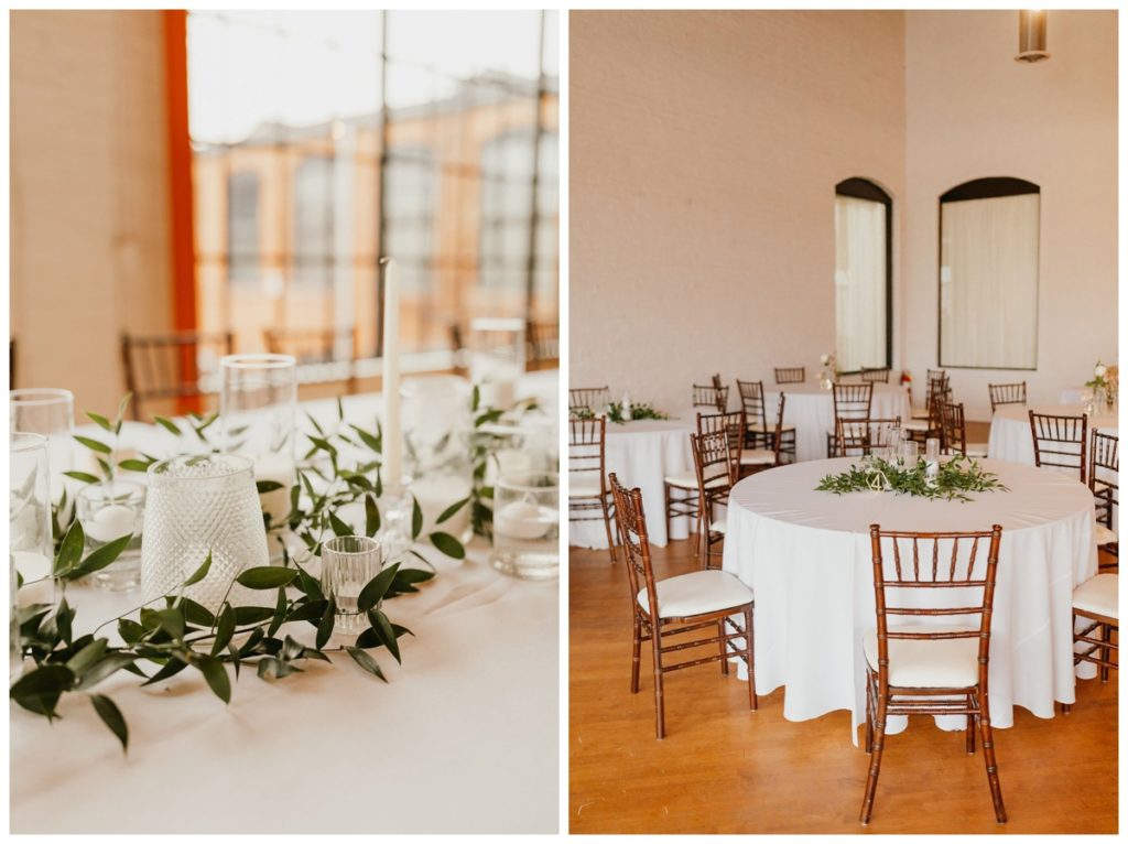 The Pointe Industrial Wedding Venue reception space with white tables, greenery and brown chairs
