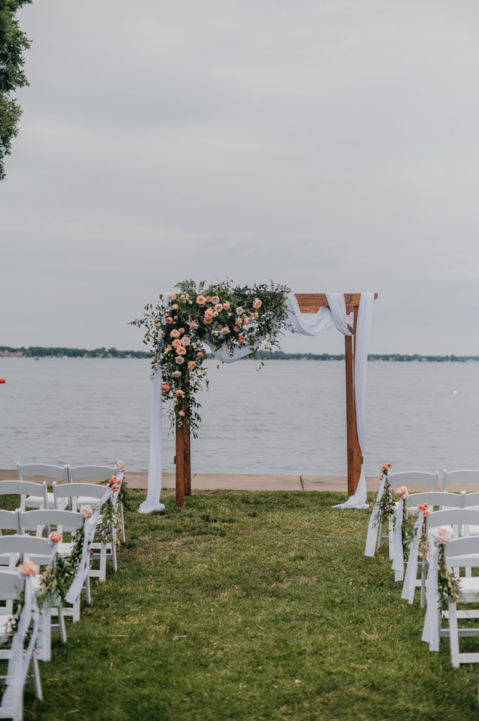 wedding ceremony arch on the edge of a lake in Indiana