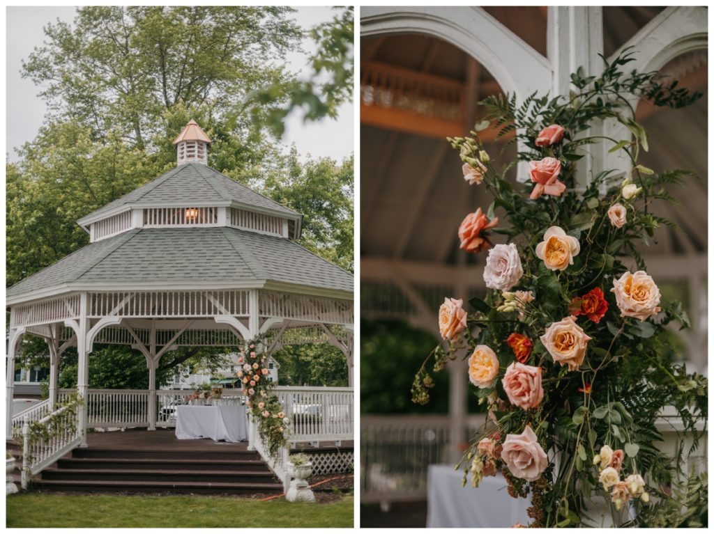 white gazebo with fresh flower arrangements was the setting for a flavored water station 
