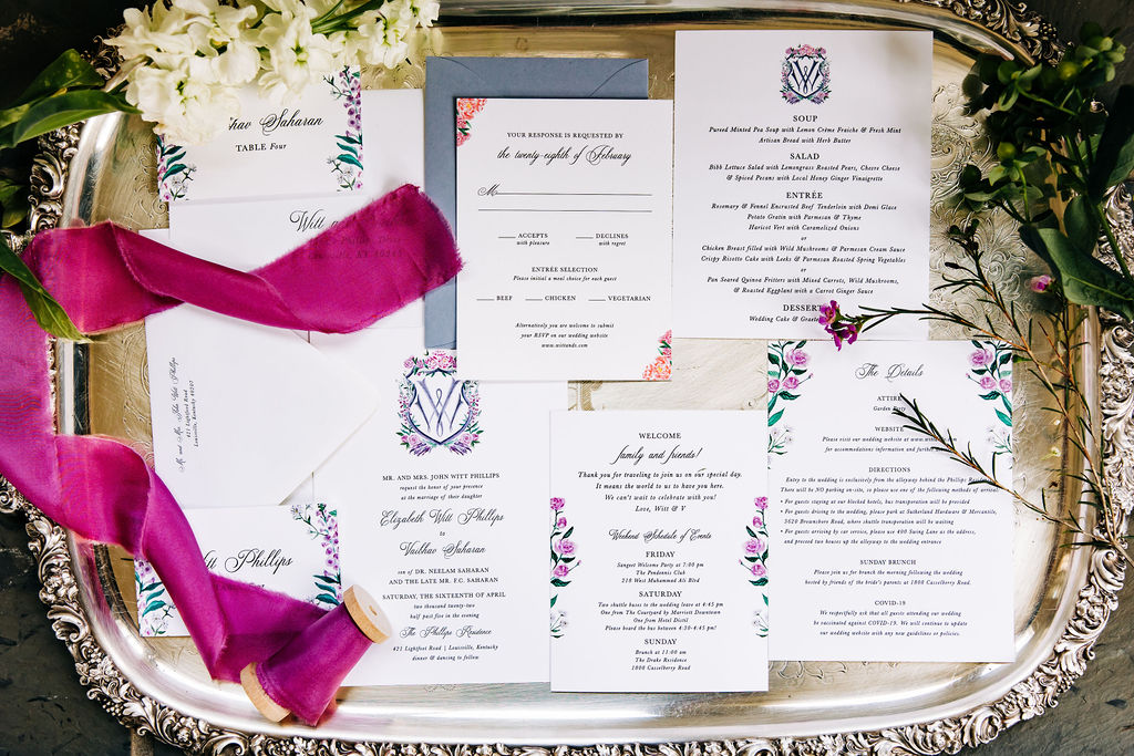 backyard wedding invitation layout on a a metal tray 
