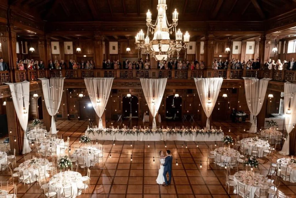 bride and groom do a solo dance on their dance floor in the center of their wedding reception at scottish rite cathedral